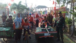 Demi Suksesnya Karnaval Di Desa Binaan, Babinsa 0816/13 Wonoayu Bantu Pengamanan