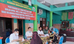 Babinsa Penatarsewu Melaksanakan Giat Pendampingan Penyaluran BLT - DD