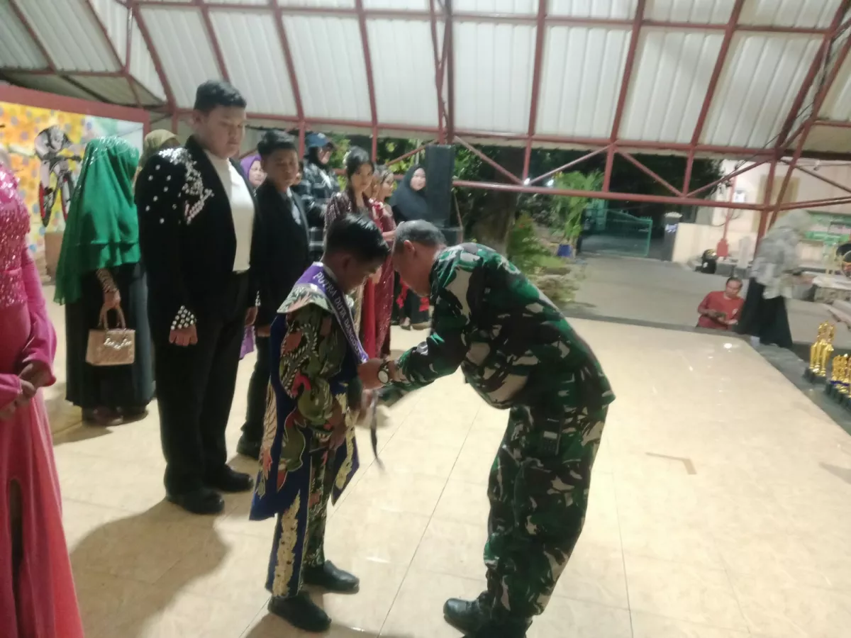 Danramil Waru Dampingi Malam Puncak IDJ  dengan Kepedulian Sosial